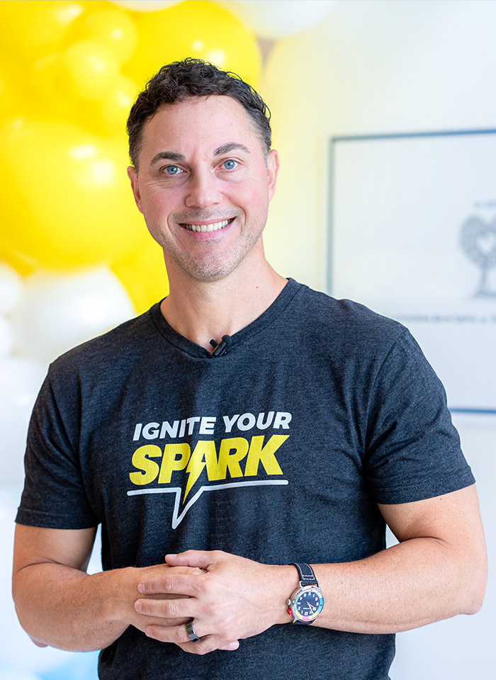 Todd Bertsch wearing Ignite Your Spark t-shirt